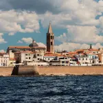 Alghero, la città catalana: storia della lingua algherese, torri aragonesi e spiagge da non perdere